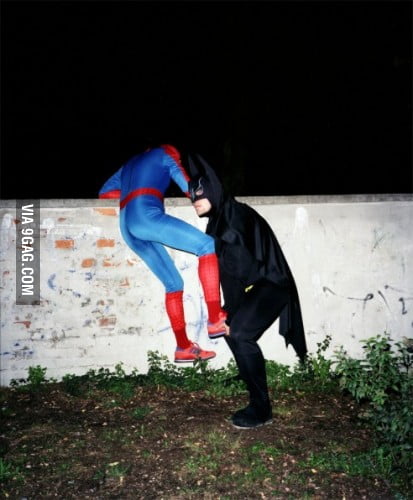 Batman helping Spiderman climb over a brick wall - 9GAG