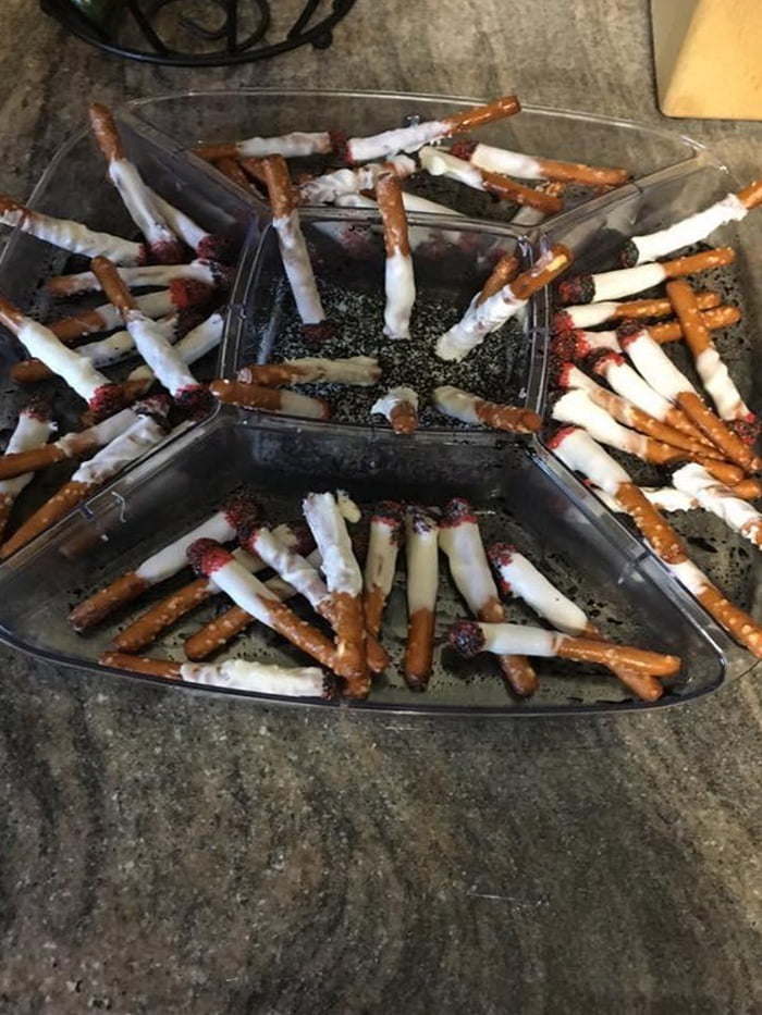 Pretzel sticks dipped in yogurt with a touch of strawberry jam on the