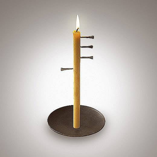 An example of a medieval candle clock. People would hear the nail hit
