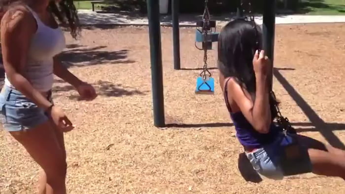 Pulling a massive swing wedgie on her friend.