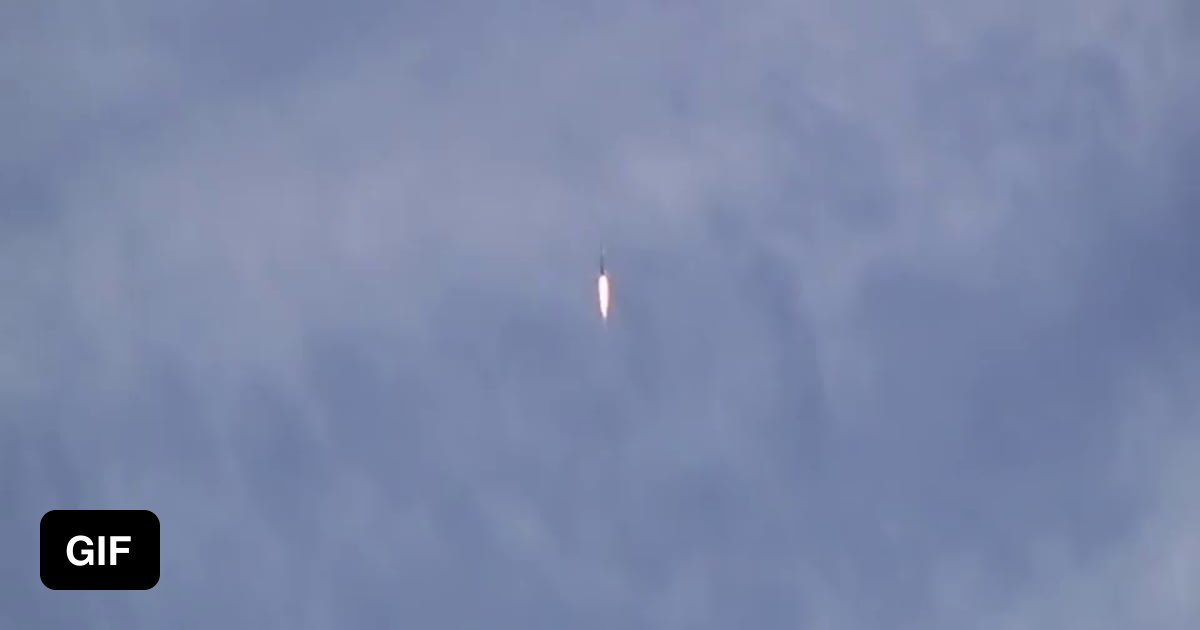 Supersonic shockwaves visible as rocket passes through clouds composed ...