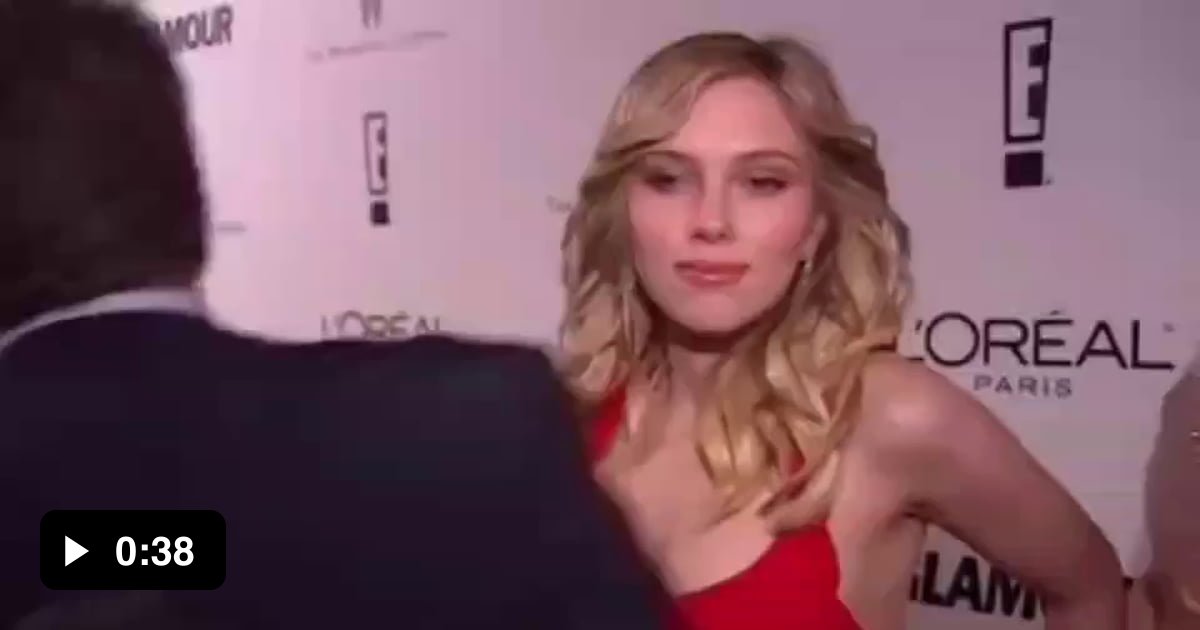 A woman completely disappearing behind Scarlett Johansson on the red carpet - 9GAG