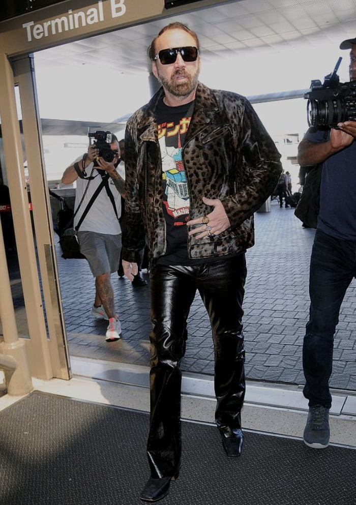 Is it me or Nicolas Cage is starting to look like a gay pimp - WTF.