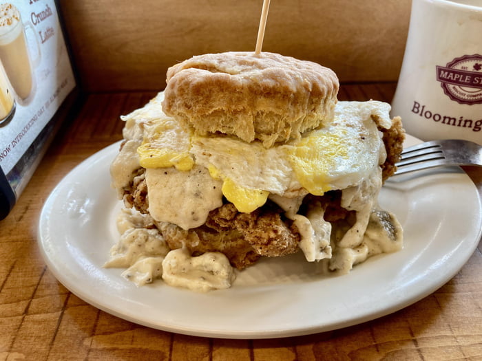 The Cowboy chicken fried steak, bacon, egg, and gravy on a biscuit 9GAG