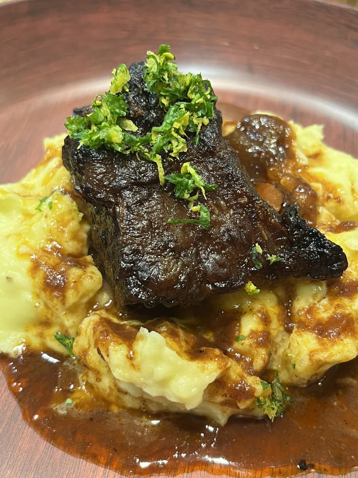 Red wine braised short rib topped w/ gremolata. Creamy herb and garlic