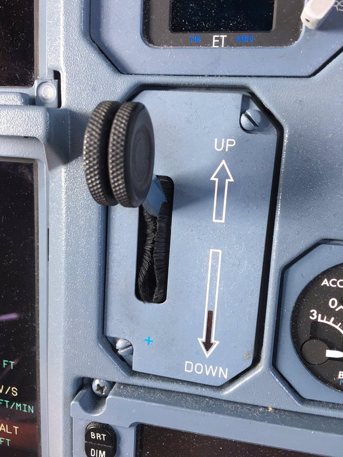 This airplane landing gear lever, shaped like a wheel, used to help