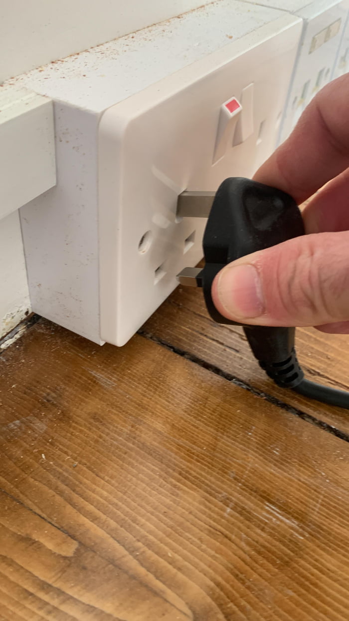 Electrician put outlet too low can’t plug anything into it…🤦🏻♂️ 9GAG