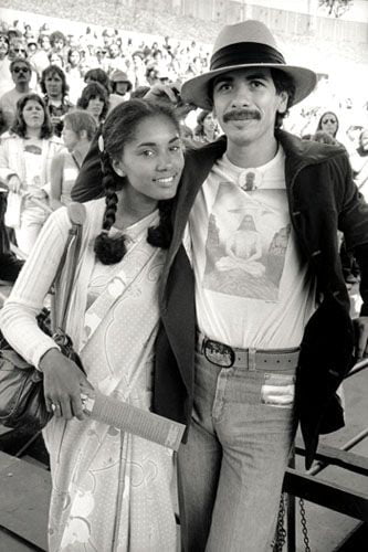 Carlos Santana and wife Debra arrive at the 77th Annual Academy