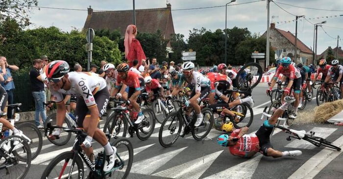 Primoz Roglic (yellow helmet) popped his own dislocated shoulder back ...