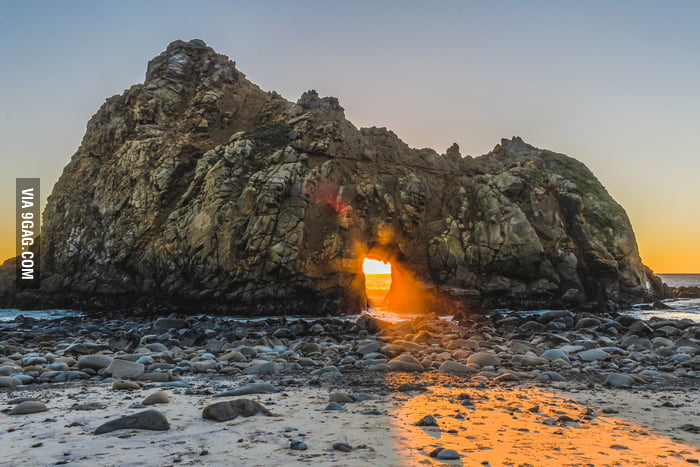 Sunlight shining through the Keyhole Rock in Big Sur, California - 9GAG