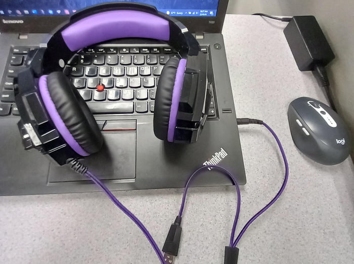 Why do most laptop companies place the headphone jack on the right