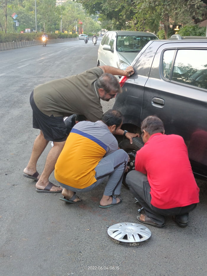 man-sees-other-man-changing-tire-man-brain-must-stop-give-useless