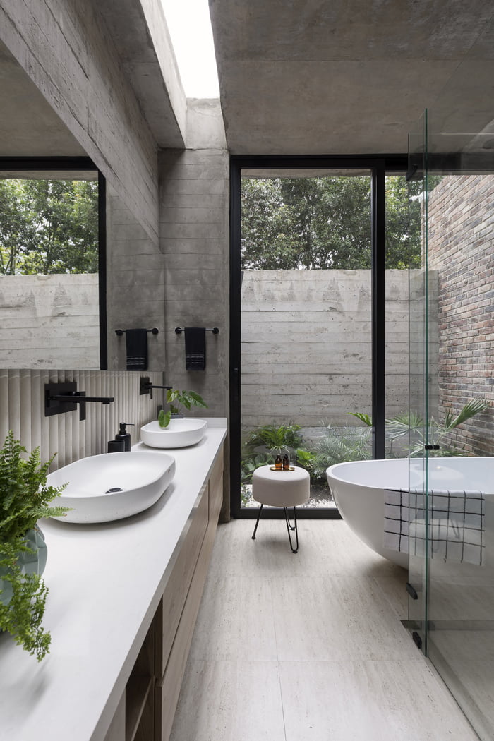 Exposed concrete wall bathroom full of natural light, Subachoque ...