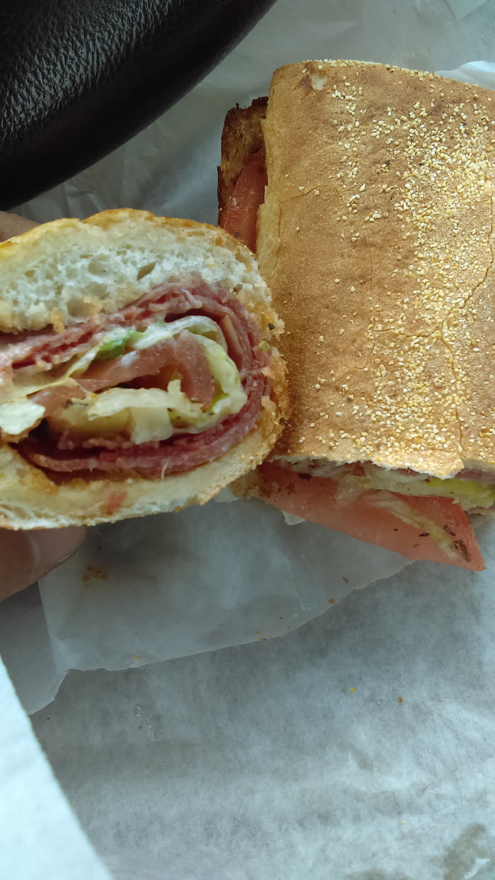A sandwich with capicola, mortadella, pepperoni, salami, and provolone
