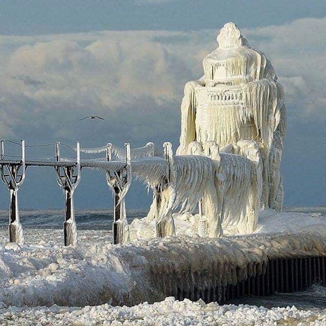 Ice covered lighthouse on Lake Michigan - 9GAG