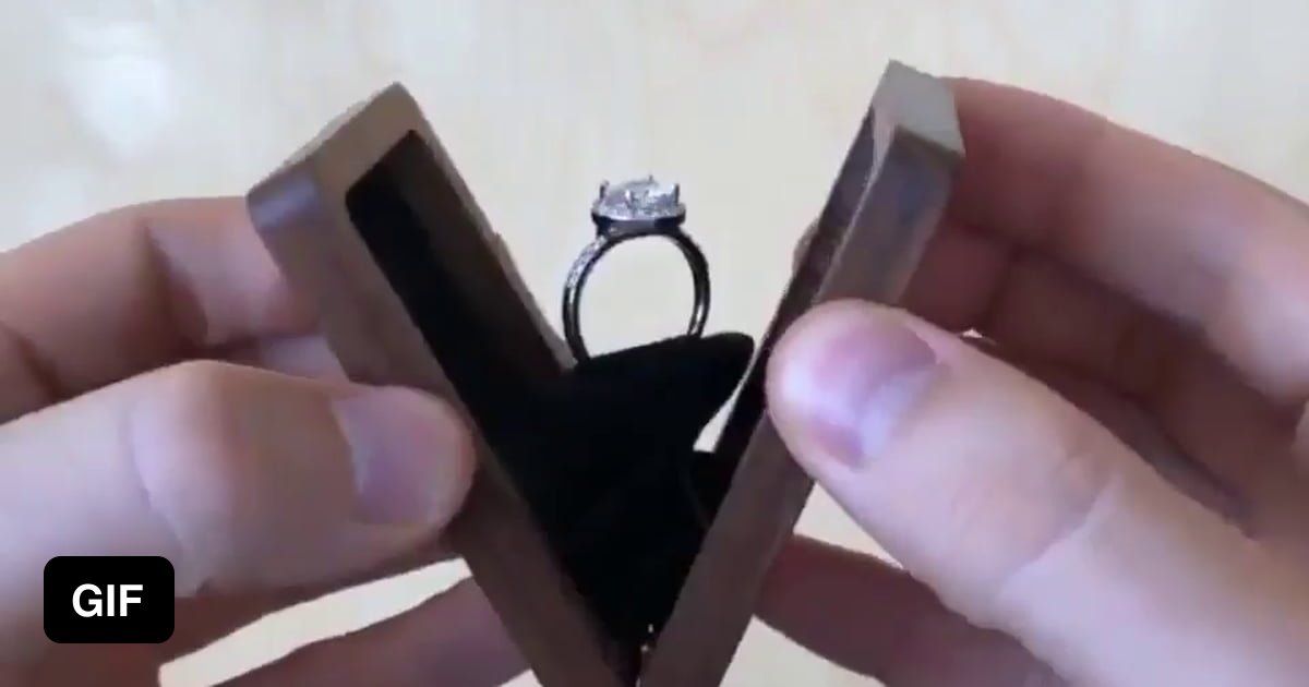 A slim wooden ring box with a rotating display 9GAG