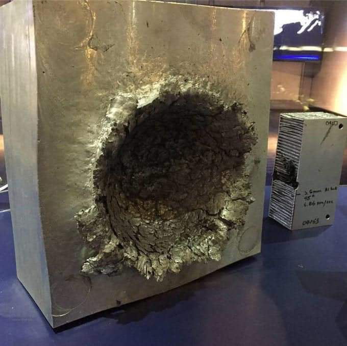 this-is-what-happens-to-a-block-of-aluminum-when-hit-by-a-14g-piece-of