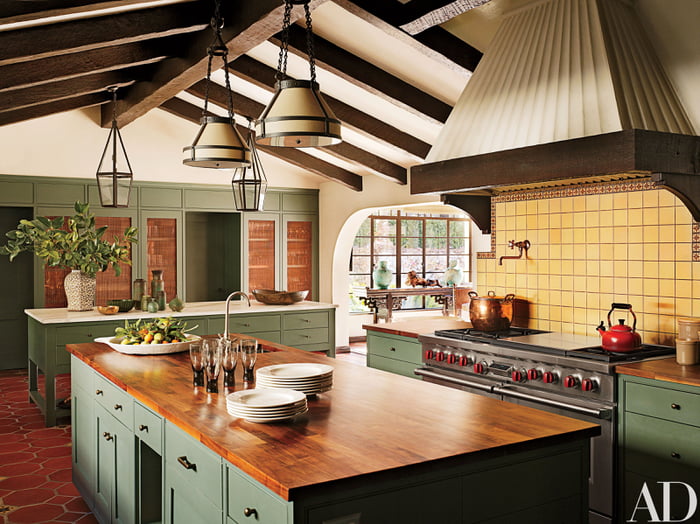 Kitchen with green cabinetry in a restored and renovated 1930s ...