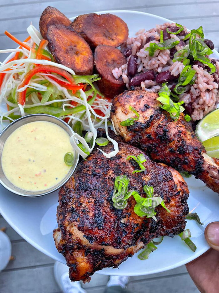 Smoked jerk chicken with coconut rice, plantains, salad and scotch