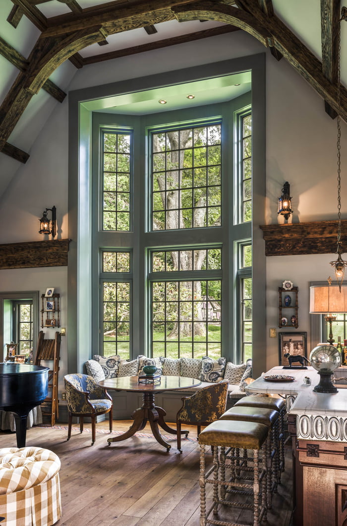 Massive bay window with seating in the family room extension of a 1920s ...