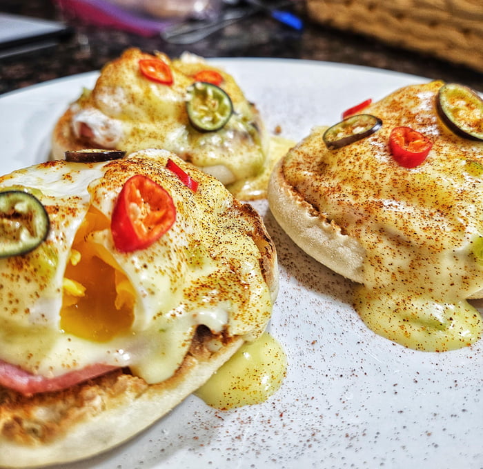 Eggs Benedict with roasted green chile hollandaise and local peppers