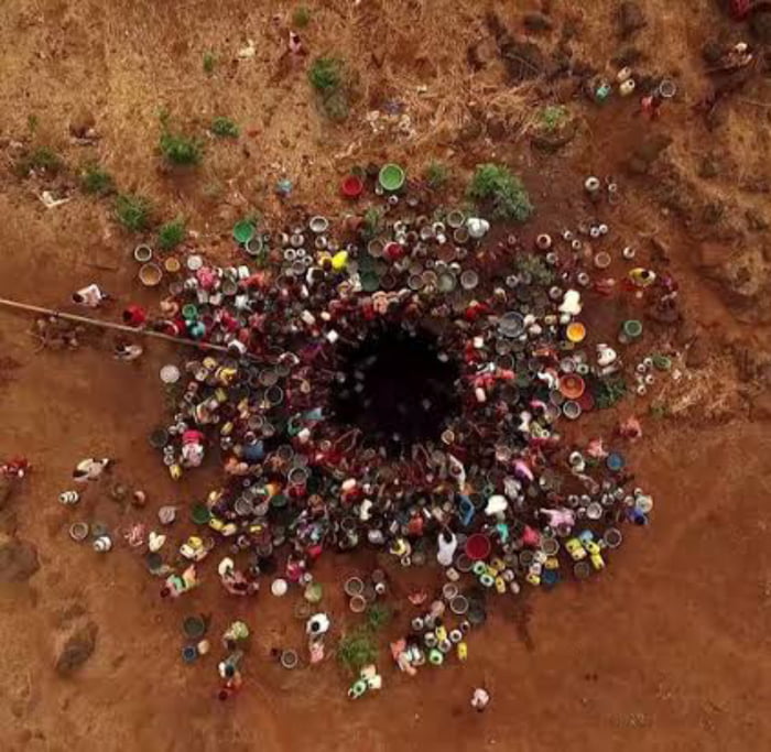 People fetching water from a well. - 9GAG