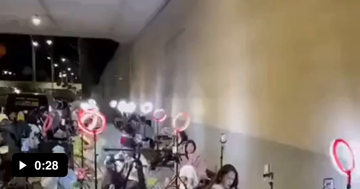 Streamers working under an overpass in a wealthy neighborhood to game