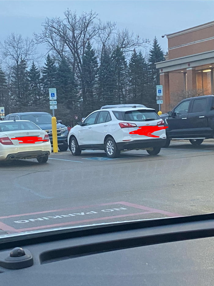 This non-handicapped vehicle taking up two handicapped parking spots at