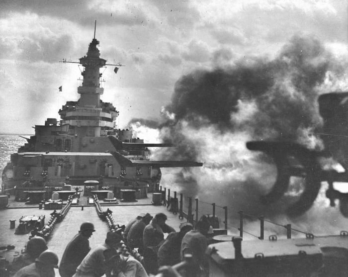 Members of the crew of the battleship USS Wisconsin, BB-64, on the deck ...