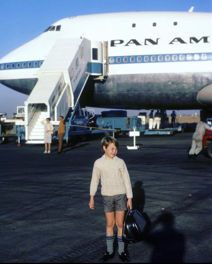 A young passenger preparing to board a Pan American World Airways ...