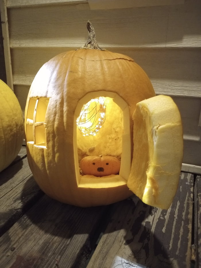 A pumpkin man sits inside a pumpkin house. Is the house made of flesh ...