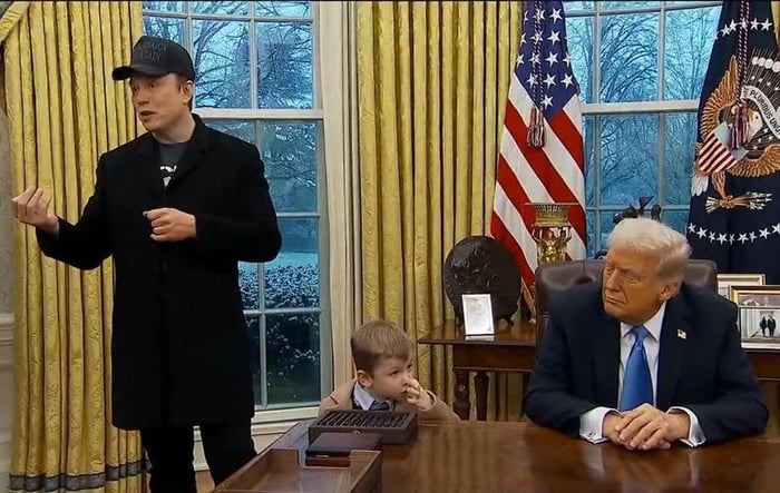 President Musk's kid eats his booger, then paws the resolute desk - 9GAG