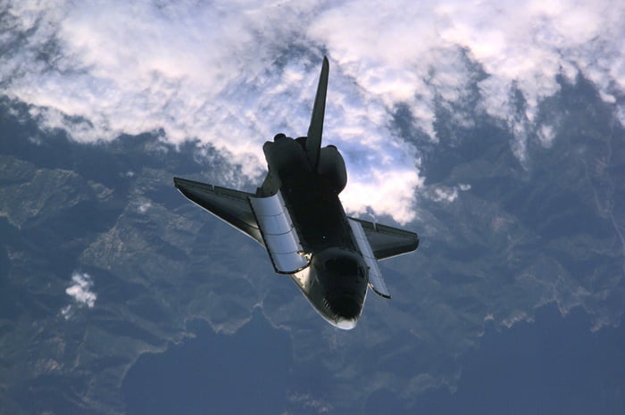 The Space Shuttle Atlantis approaches the International Space Station ...