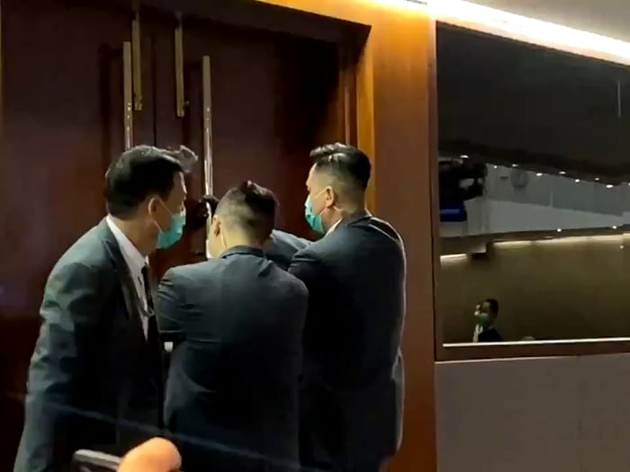 Earlier today, ballots for election of House Committee chairman were distributed to pro-Beijing lawmakers by Chan Kin-por, while evicted pro-democracy lawmakers were banging the doors held locked by LegCo security guards from inside.