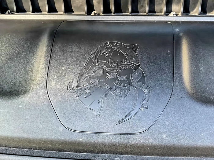 The Dodge Ram TRX has an image of a TRex eating a Velociraptor hidden