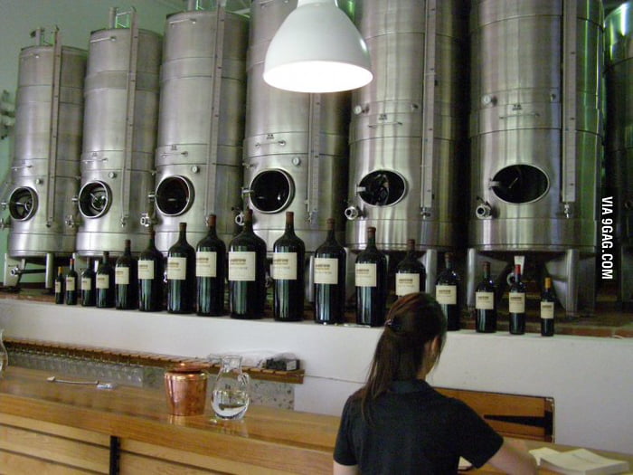 The bottle on the edge is bottle of wine of regular size. The bottle in