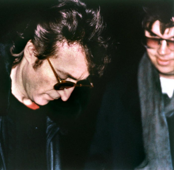 John Lennon signing an autograph outside his home in NYC to Mark David ...