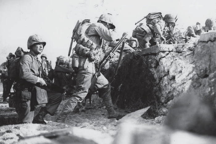 Battle of Okinawa. 1 April 1945. US Marines move off the beach on the ...