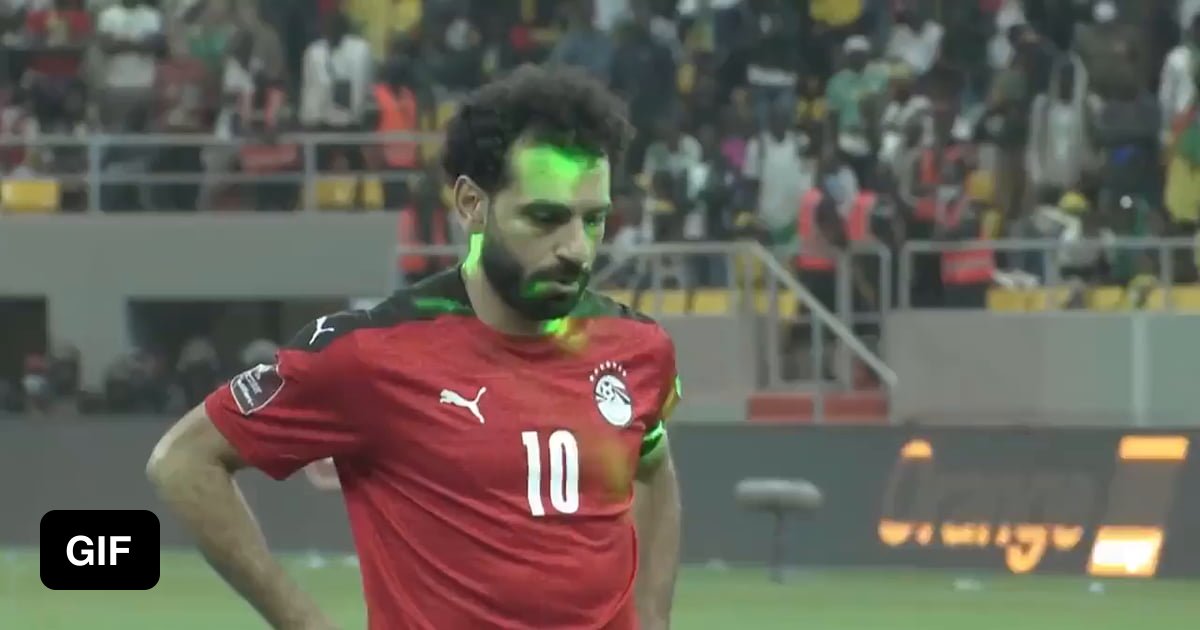 Mo Salah taking a penalty for Egypt with laser pointers in his eyes