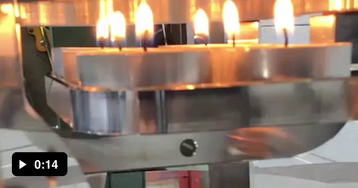 Huge Stirling engine powered by 6 tea light candles has its own cooling