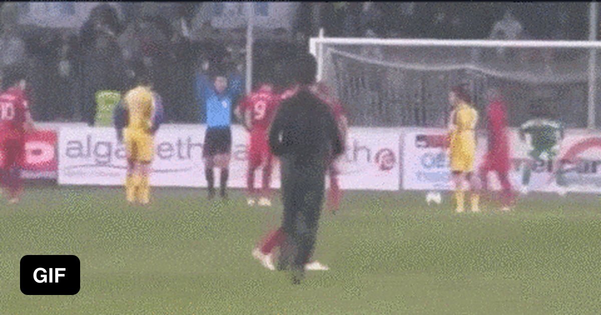 Soccer fan runs on pitch. Coward punches player on a team. Team mates