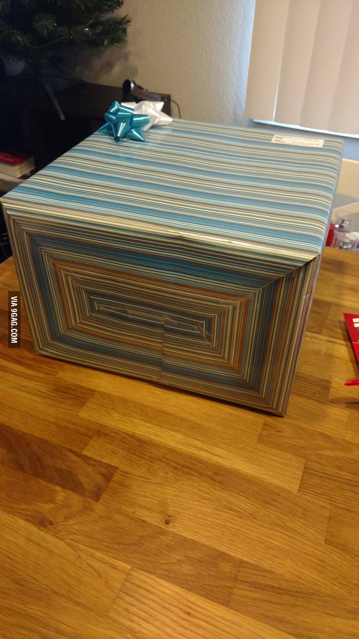 This wrapping paper job even lines up on the ends. 9GAG