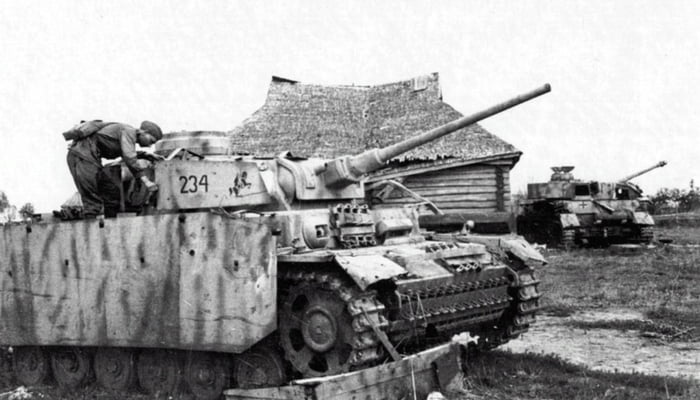 A Soviet soldier examines the abandoned German tank Pz.III Ausf. J - 9GAG