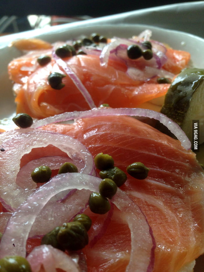 Classic everything bagel w schmear, lox, red onion, and capers at