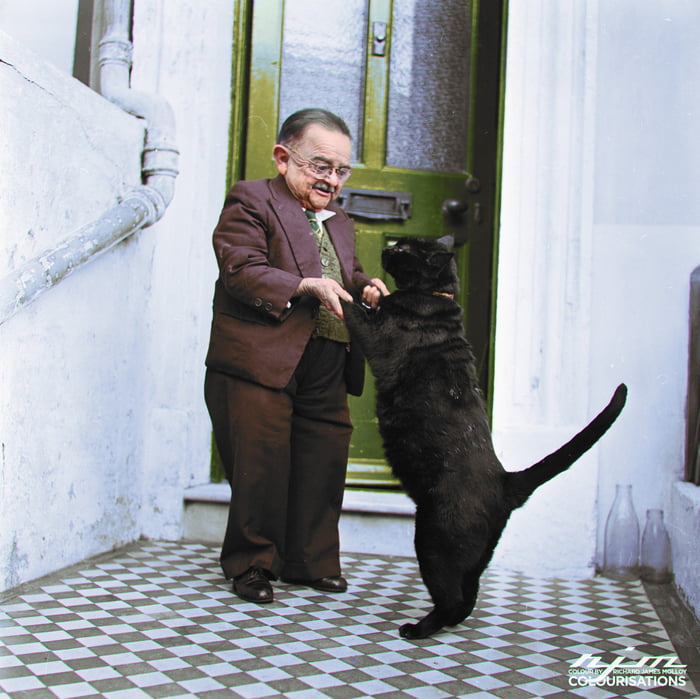 Henry Behrens, the smallest man in the world, dances with his cat, 1956 ...