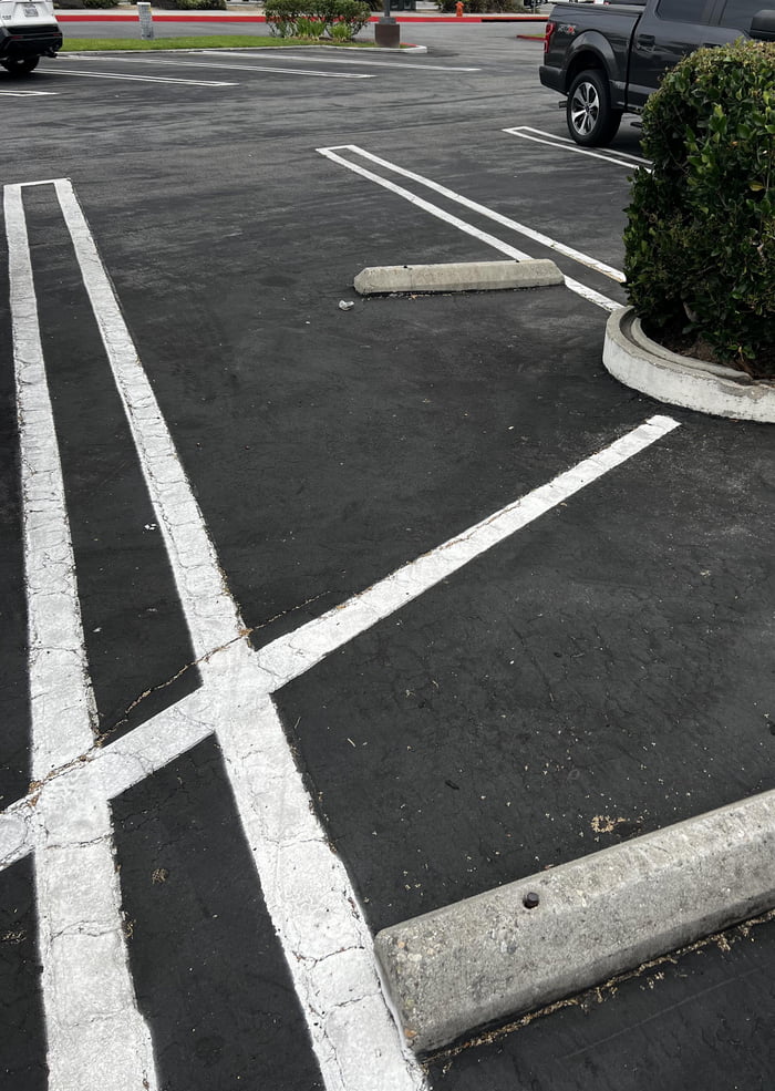 The location and angle of these parking blocks… 9GAG