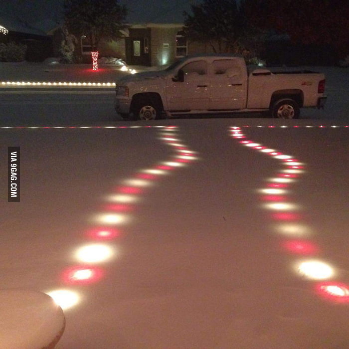 Christmas lights still glowing beneath the snow in Midland TX 9GAG