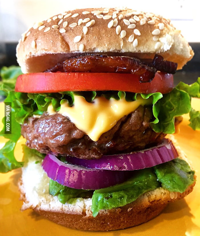 Charcoal grilled to medium rare Backyard Bacon Cheeseburger with