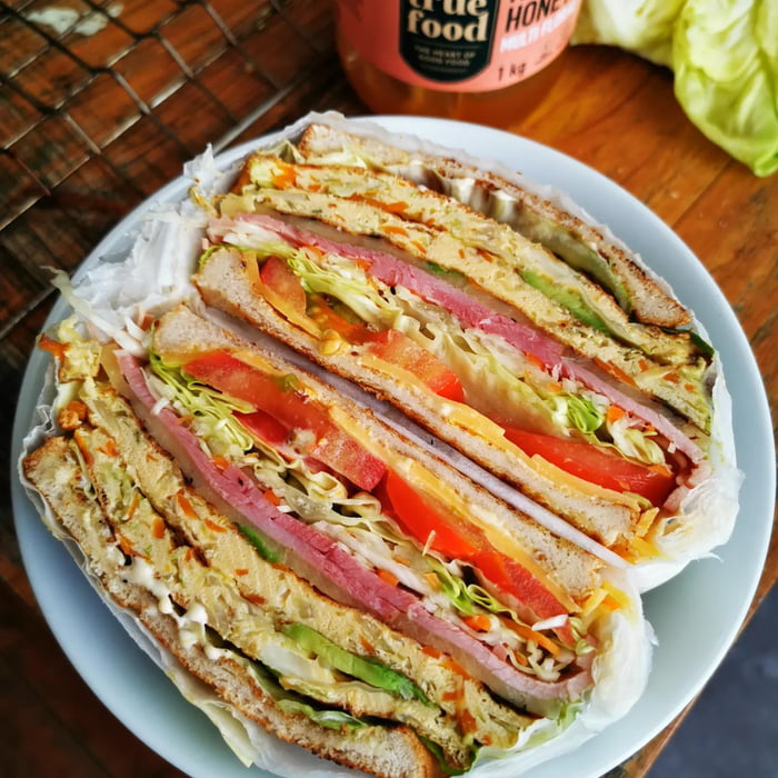 Breakfast sandwich omlette stuffed with cabbage, carrot and shallots