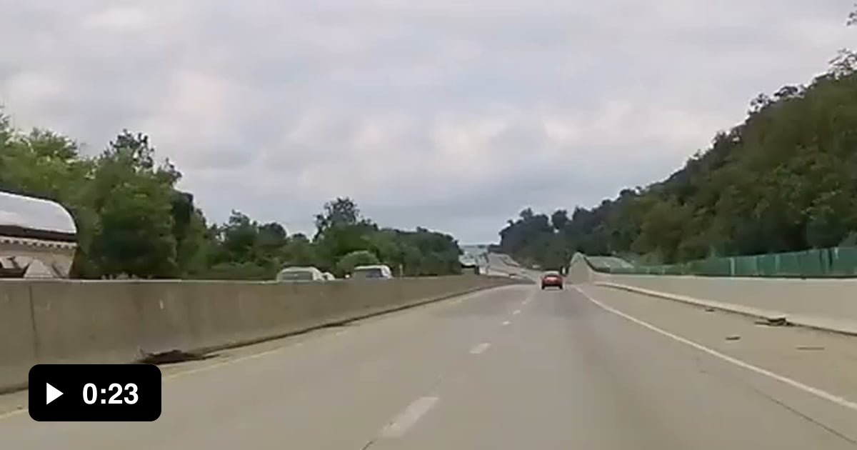 Driver randomly drifts and slams into concrete barrier, then continues ...